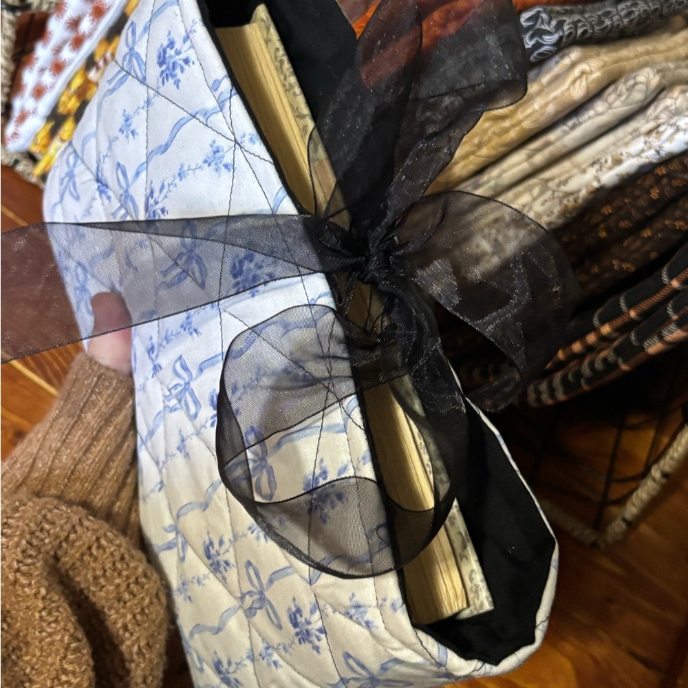 Elegant Blue Floral Book Cover with Black Ribbon